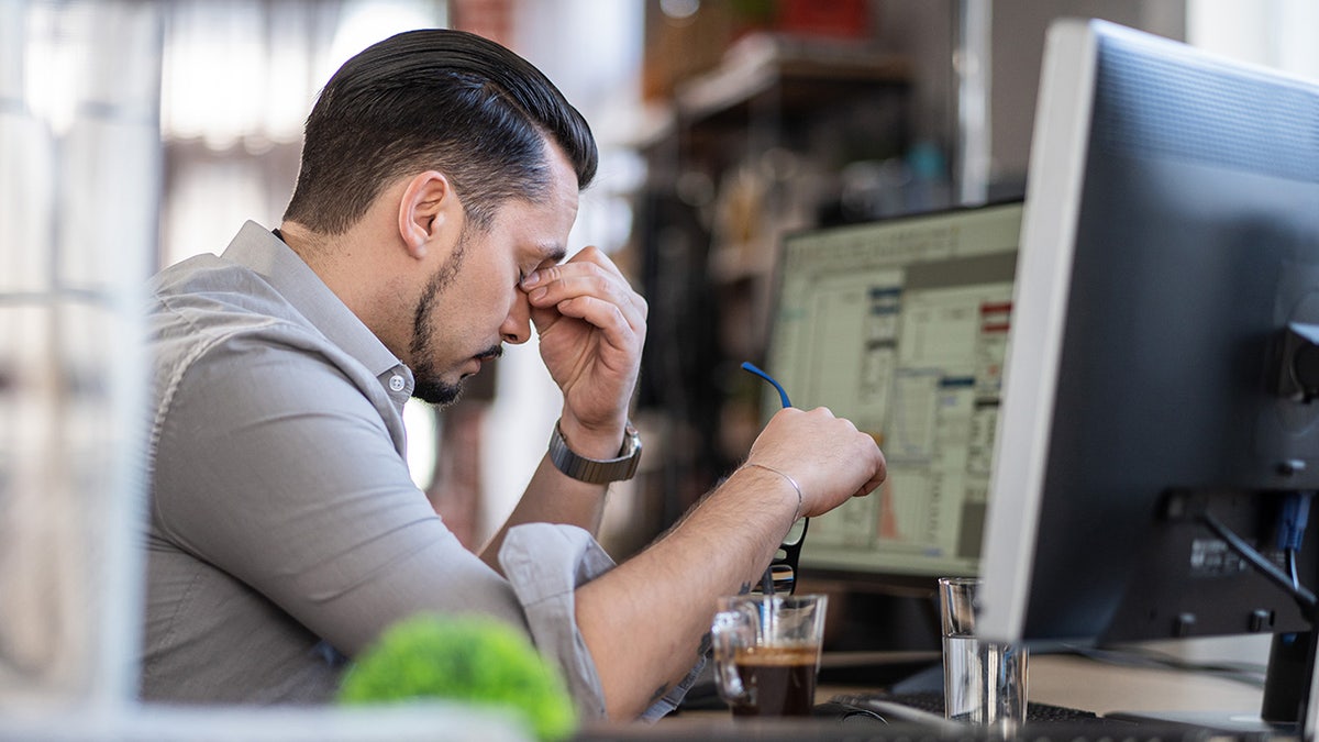 The man who works on the computer was stressed